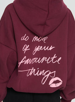 side view of model wearing Princess Polly Kisses Graphic Hoodie Wine Longline Jumpers 