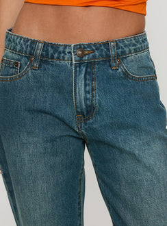 side view of model wearing Princess Polly Toros Mid Rise Wide Leg Foldover Denim Jeans Mid Blue Low Rise Jeans 