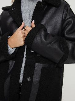 Faux leather jacket  Oversized fit, classic collar, press button fastening, twin hip pockets Non-stretch material, shearling lining