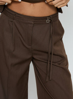 front view of model wearing Princess Polly Natilee Relaxed Tailored Pants Brown Pinstripe Low Rise Pants 