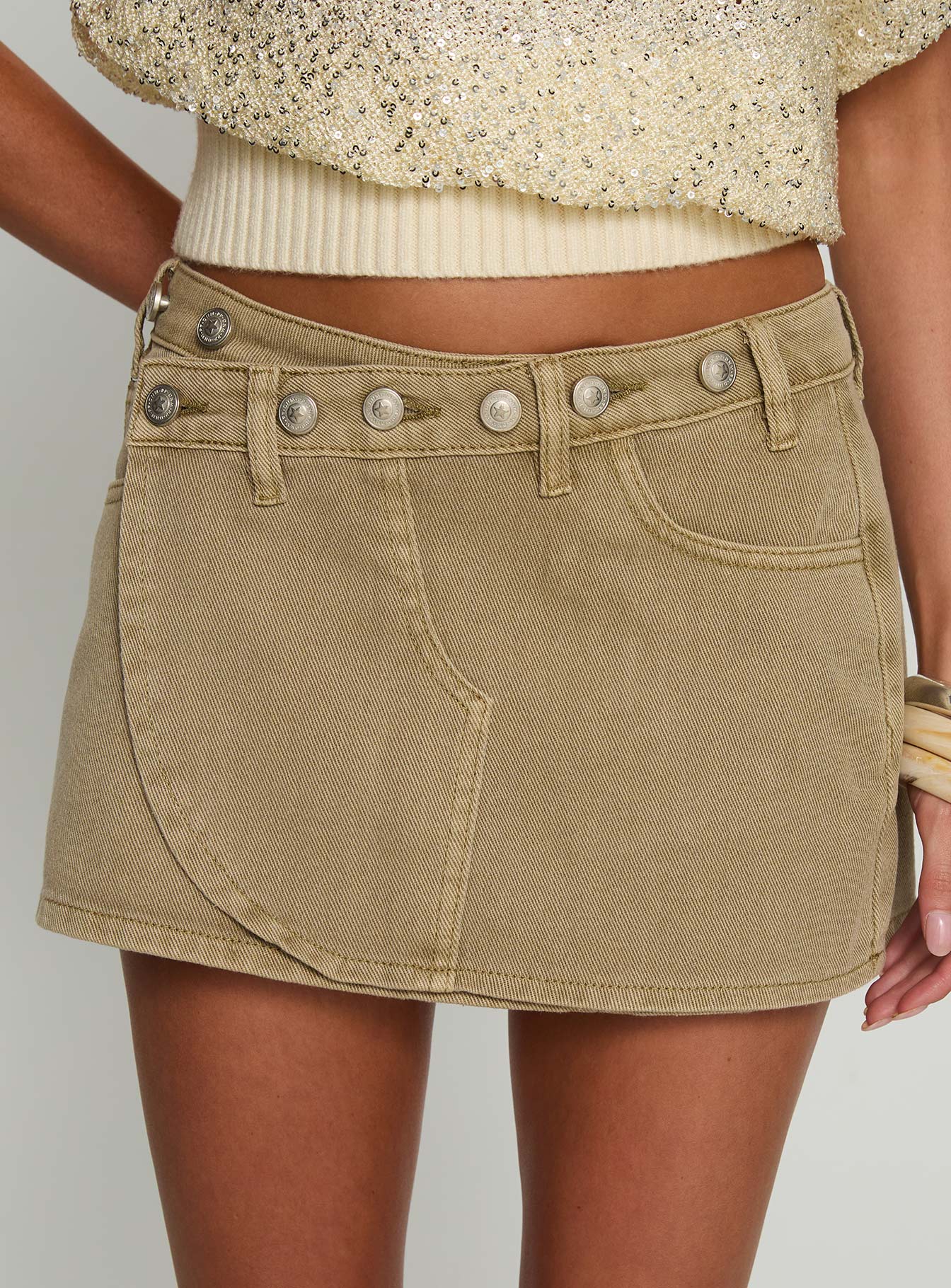 back view of model wearing Princess Polly Katlynne Button Detail Mini Skirt Washed Beige Mini Skirts 