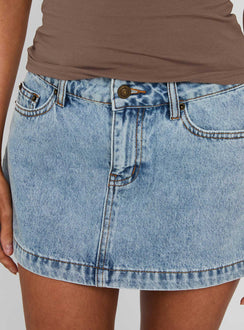 back view of model wearing Princess Polly Nicolina Low Rise Denim Mini Skirt Ice Blue Wash Tall Mini Skirts 