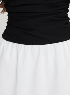 back view of model wearing Princess Polly First Impressions Strapless Mini Dress Black / White Straight Neck 