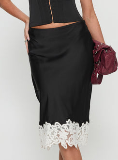   side view of model wearing Princess Polly Anchored Midi Skirt Noir Midi Skirts 