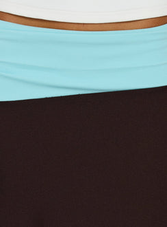Featuring the Suave Asymmetrical Contrast Midi Skirt Brown / Aqua womens-skirts in midi length view of model wearing Princess Polly