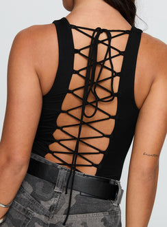 side view of model wearing Princess Polly Majesty Tie Back Bodysuit Black Sleeveless 