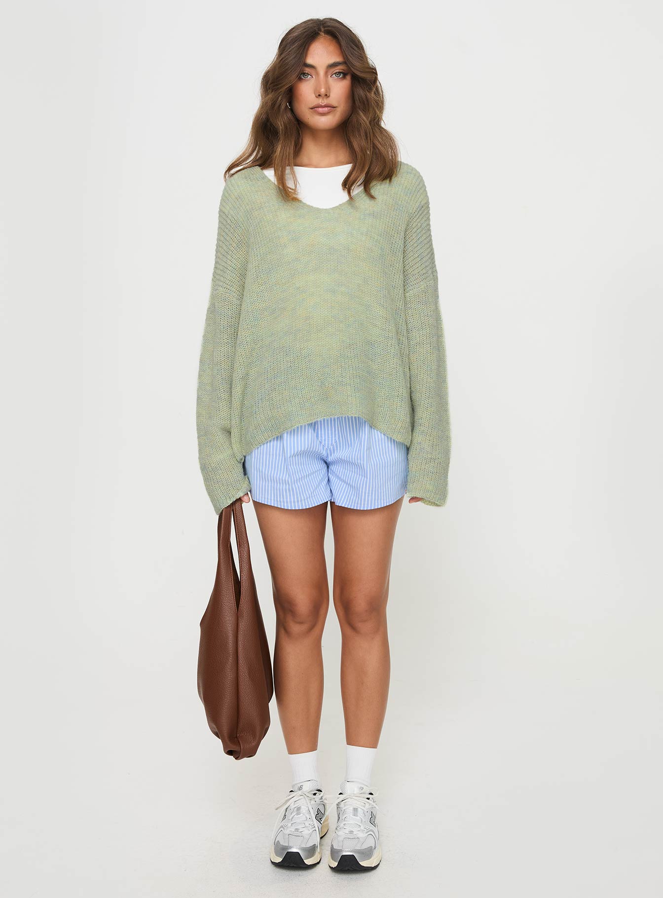 Sweater Knit material, v neckline, drop shoulder Slight stretch, unlined 