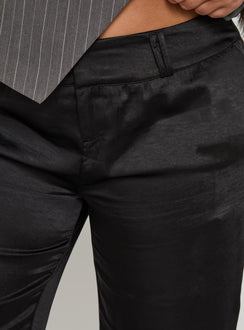 back view of model wearing Princess Polly First Place Low Rise Satin Pant Black Curve Low Rise Pants 