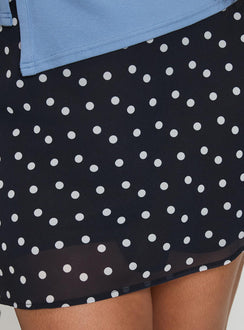 back view of model wearing Princess Polly Dapple Bias Mini Skirt Black Polka Dot Curve Mini Skirts Skirts 