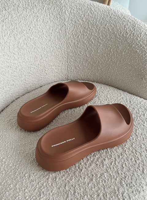 Brown slides Rubber design  Single wide upper  Platform base  Lightweight 