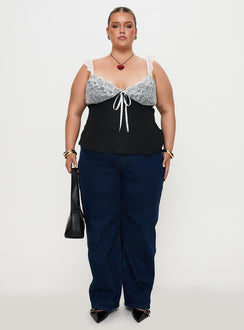 front view of model wearing Princess Polly Delvonte Top Black Curve Sleeveless Plunger 