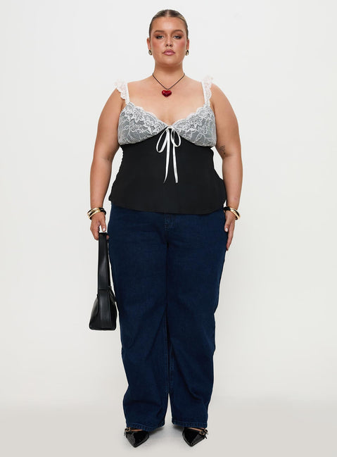 front view of model wearing Princess Polly Delvonte Top Black Curve Sleeveless Plunger 