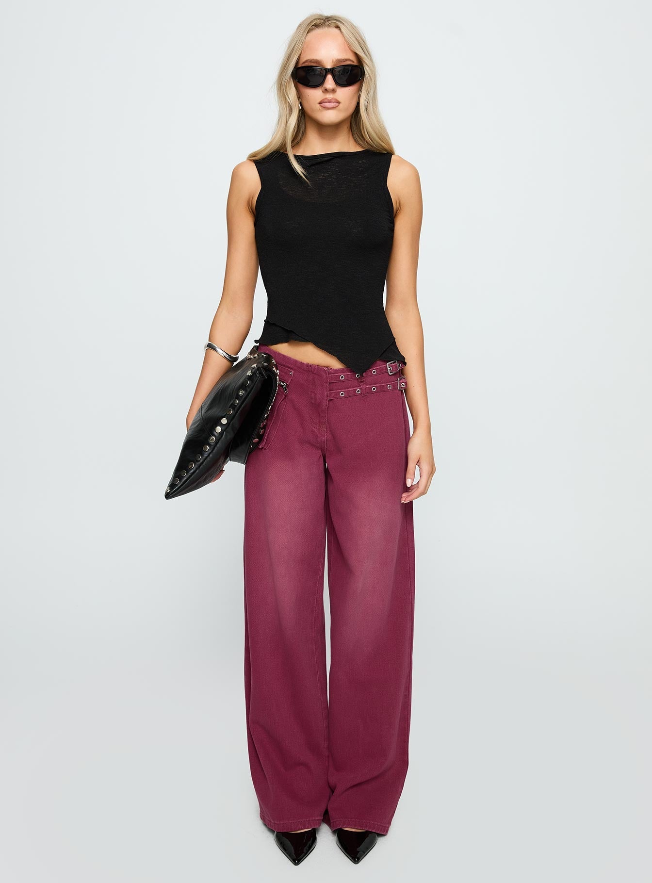side view of model wearing Princess Polly Paltrow Mid Rise Wide Leg Cargo Jeans Washed Burgundy Mid Rise Jeans 