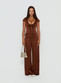 Showcasing the Aubrette Satin Tie Pants Chocolate in womens-regular-pants with high-rise wide-leg design front view of model wearing Princess Polly