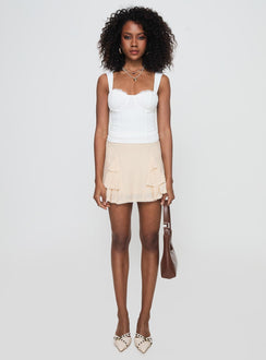 back view of model wearing Princess Polly Foalie Ruffle Mini Skirt Beige Mini Skirts 