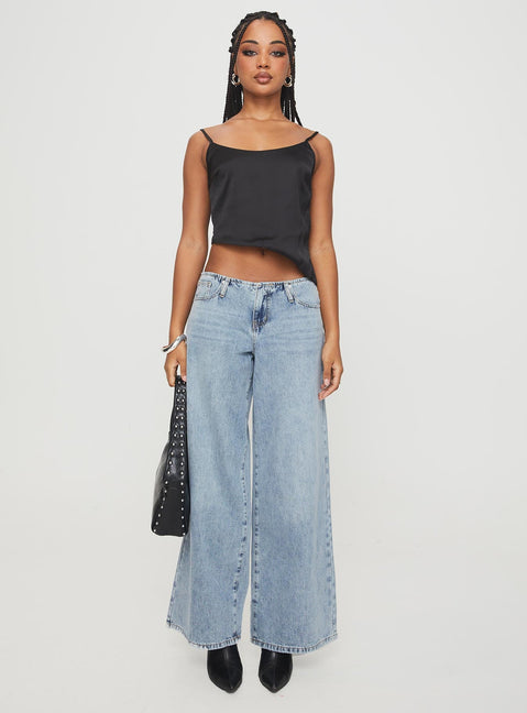 side view of model wearing Princess Polly Olivette Top Black Sleeveless Scoop Neck 