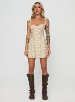 front view of model wearing Princess Polly Landon Mini Dress Yellow Floral Petite Scoop Neck 