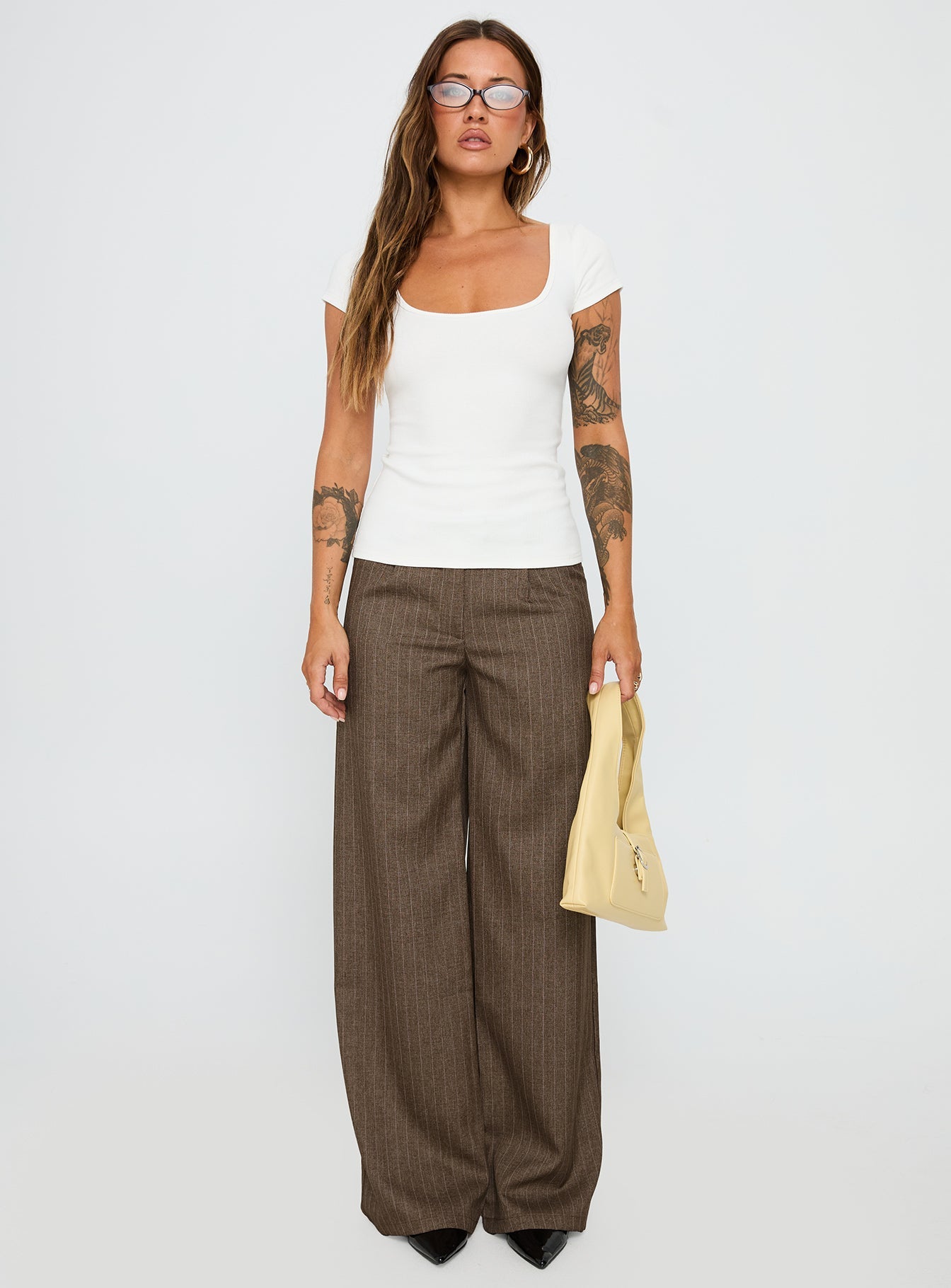 front view of model wearing Princess Polly Broadcast Pants Beige Pinstripe Low Rise Pants 