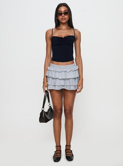 side view of model wearing Princess Polly Kipper Low Rise Skort Grey Low Rise Shorts 