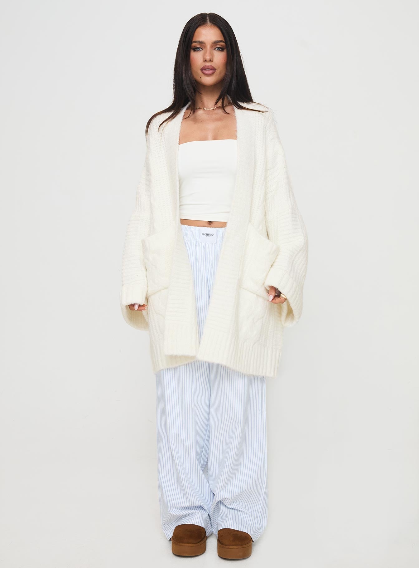 front view of model wearing Princess Polly Paisleigh Cable Knit Cardigan Cream Long 
