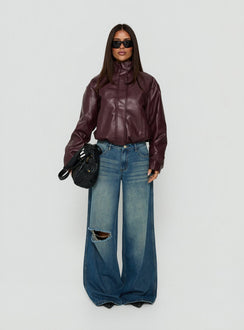 Showcasing the Ramos Low Rise Wide Leg Distressed Jeans Dark Indigo womens-jeans front view of model wearing Princess Polly