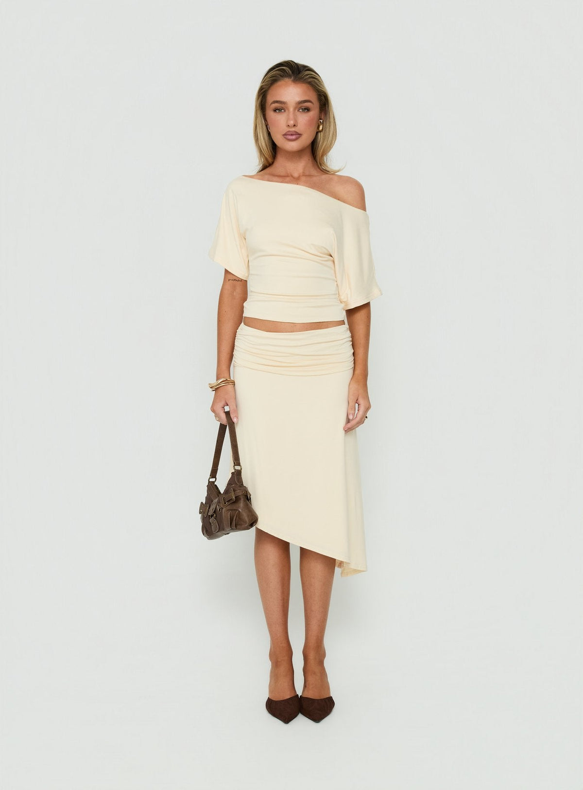 Featuring the Sezzia Ruched Asymmetrical Midi Skirt Beige womens-skirts with fitted silhouette and length detail Princess Polly