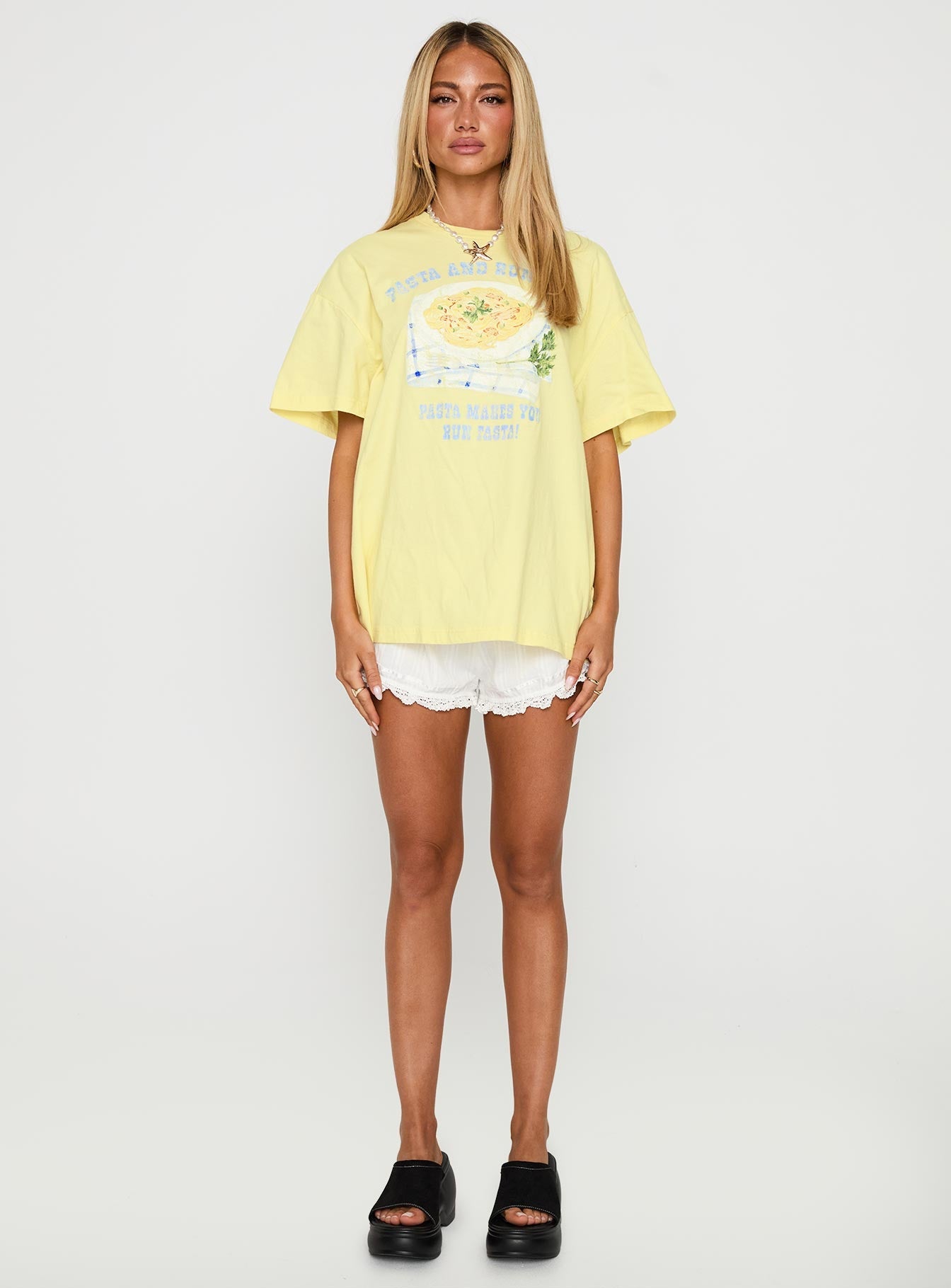 side view of model wearing Princess Polly Pasta Makes You Fasta Oversized Tee Yellow Half Sleeves Crew Neck 