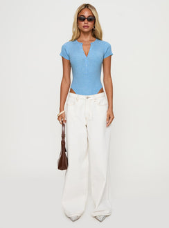 side view of model wearing Princess Polly Kerra Short Sleeve Bodysuit Blue Short Sleeves 