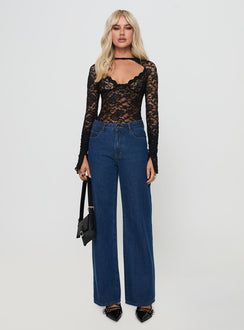 front view of model wearing Princess Polly Giallo Long Sleeve Bodysuit Black Full Sleeves 