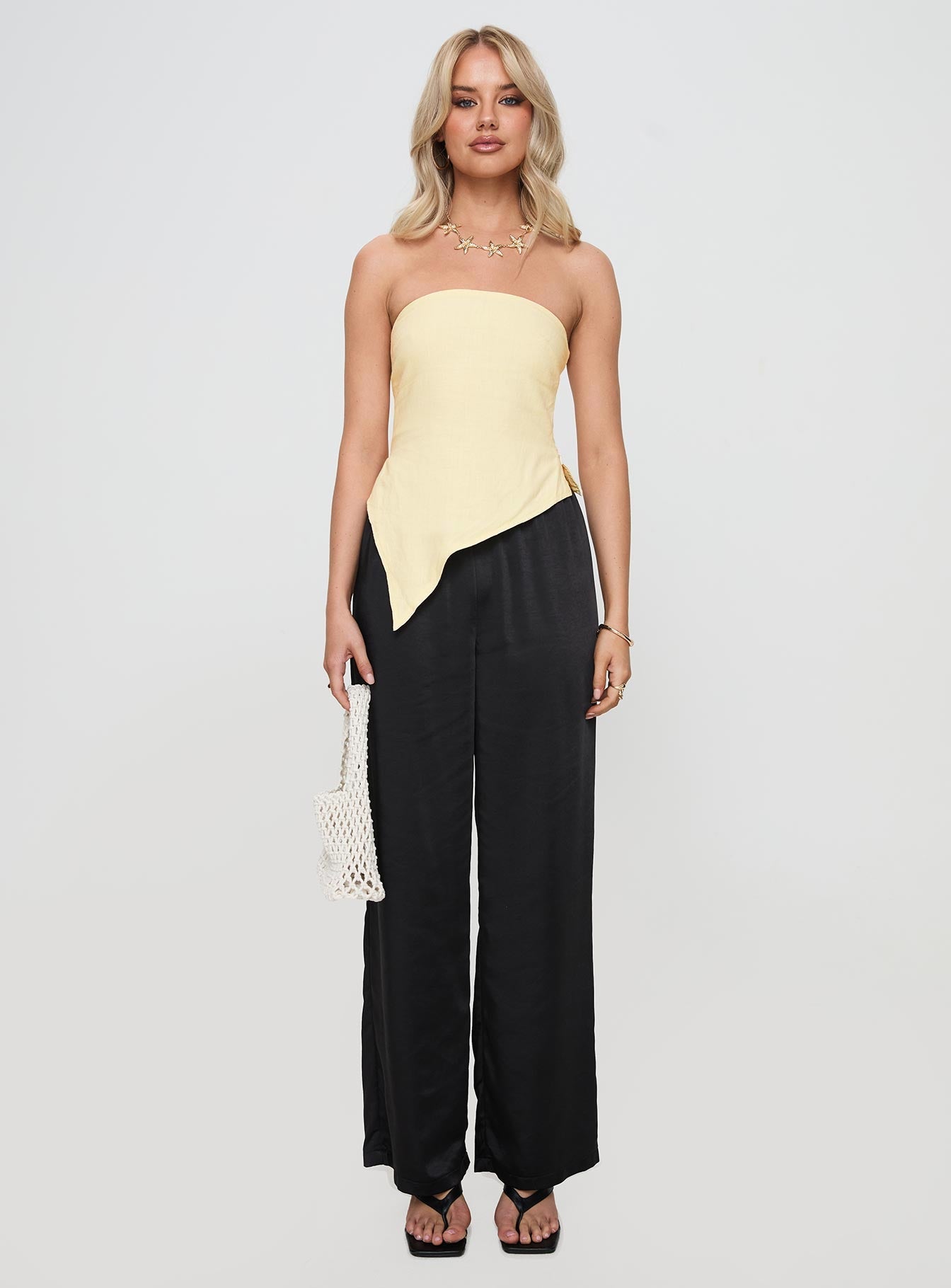 front view of model wearing Princess Polly Birdie Asymmetric Linen Blend Top Lemon Sleeveless straight 