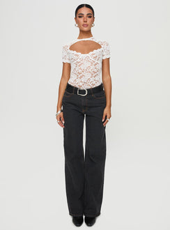 side view of model wearing Princess Polly Giallo Bodysuit White Short Sleeve 