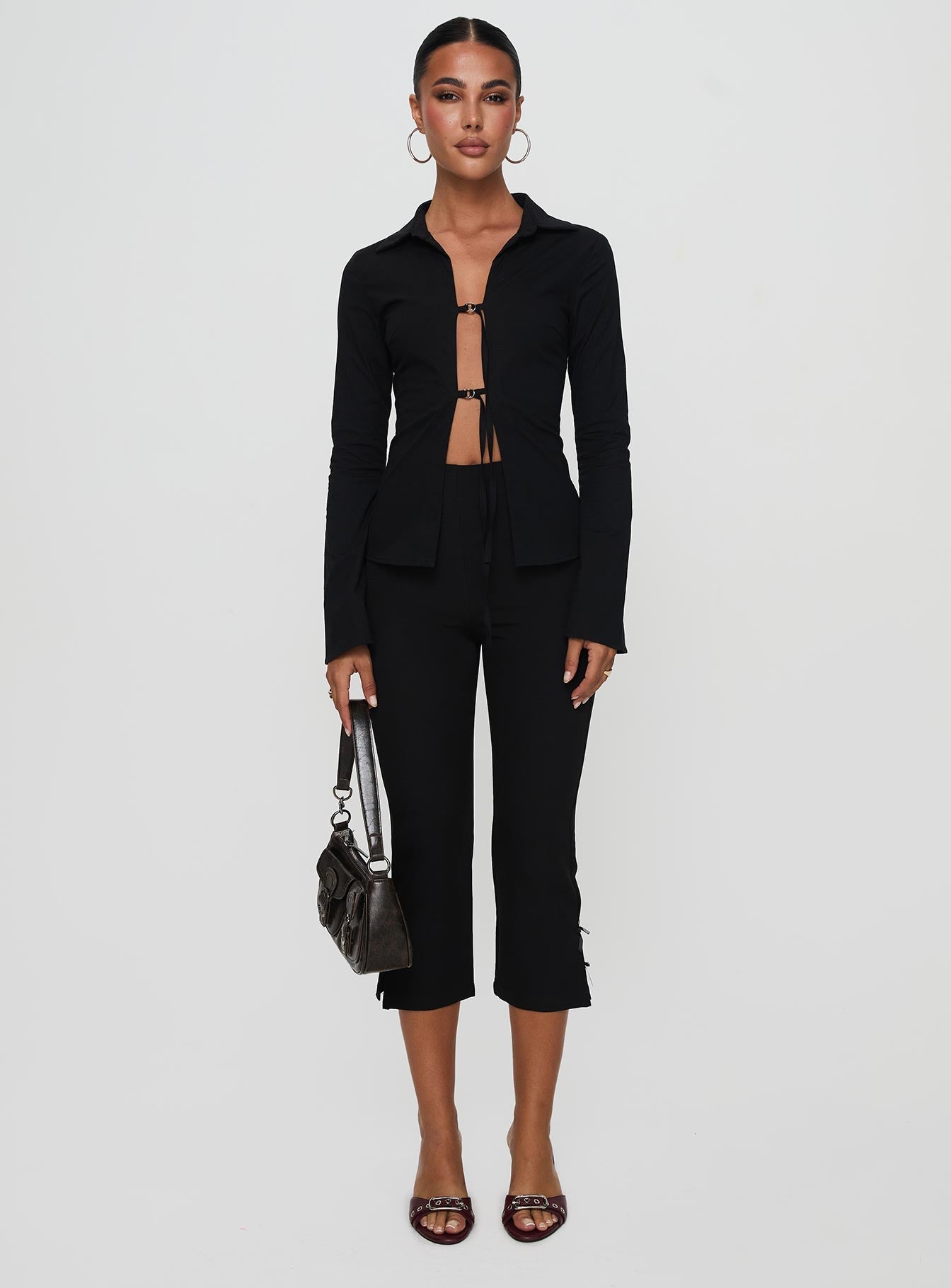 front view of model wearing Princess Polly Nataline Long Sleeve Top Black Full Sleeves Plunger 