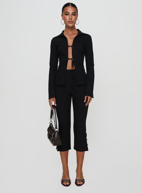 front view of model wearing Princess Polly Nataline Long Sleeve Top Black Full Sleeves Plunger 