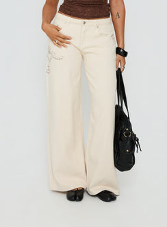 front view of model wearing Princess Polly Than Forever Love Graphic Denim Jeans Cream Low Rise Jeans Jeans 