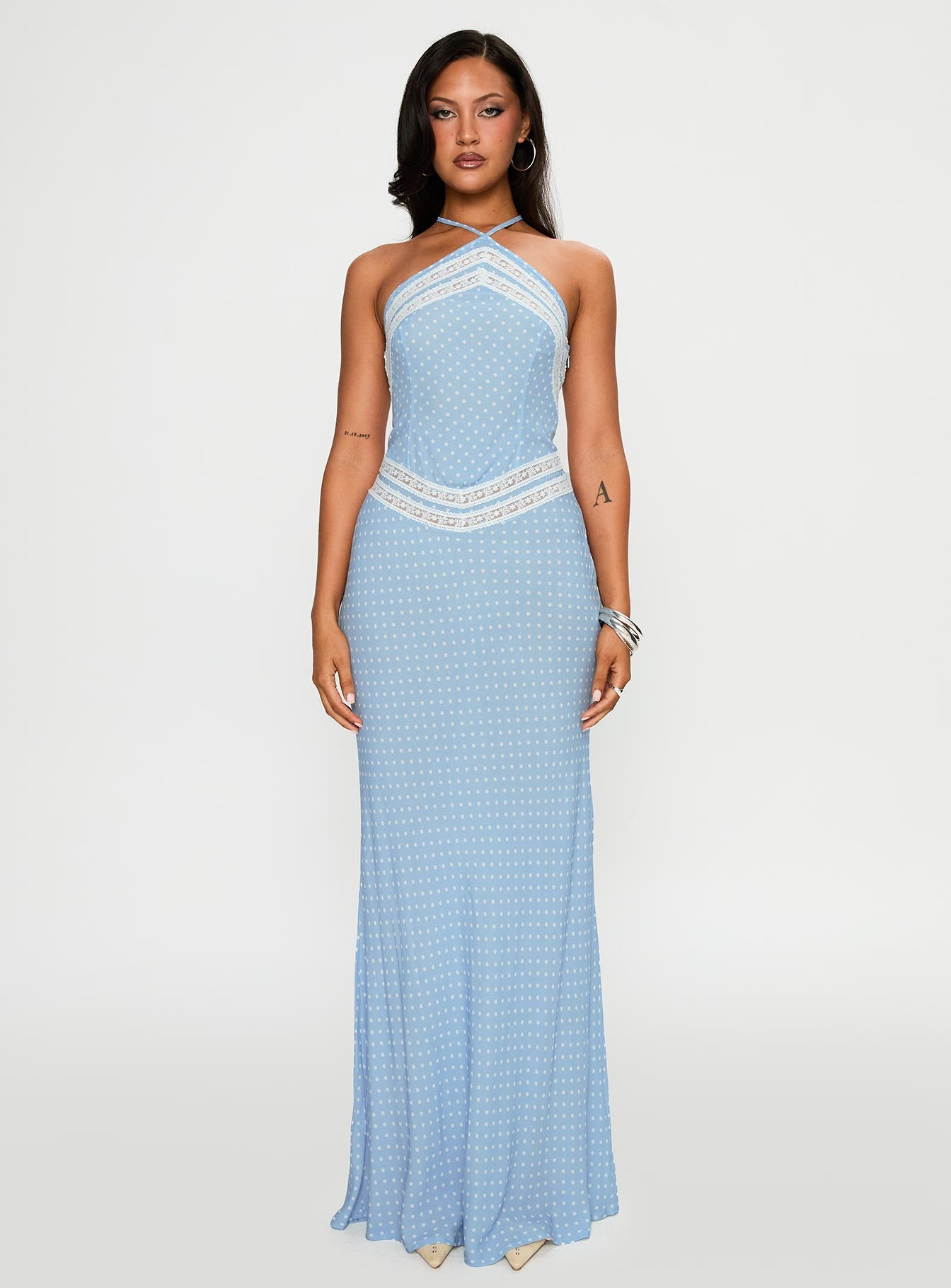 front view of model wearing Princess Polly Wild Joy Halter Maxi Dress Blue Polka Asymmetric Neckline 
