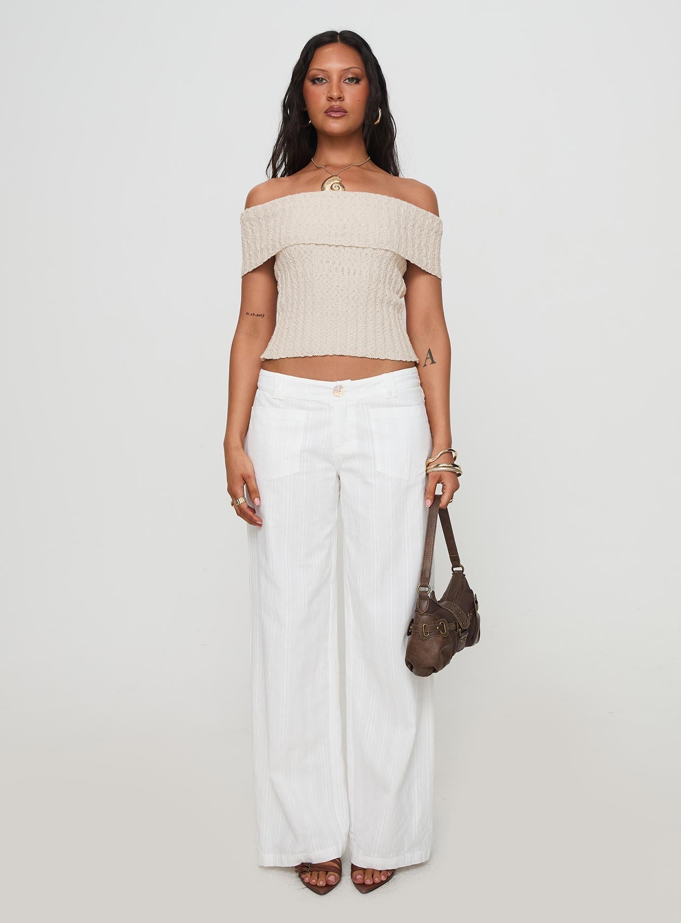 front view of model wearing Princess Polly Vendi Low Rise Pant White Petite Low Rise Pants 