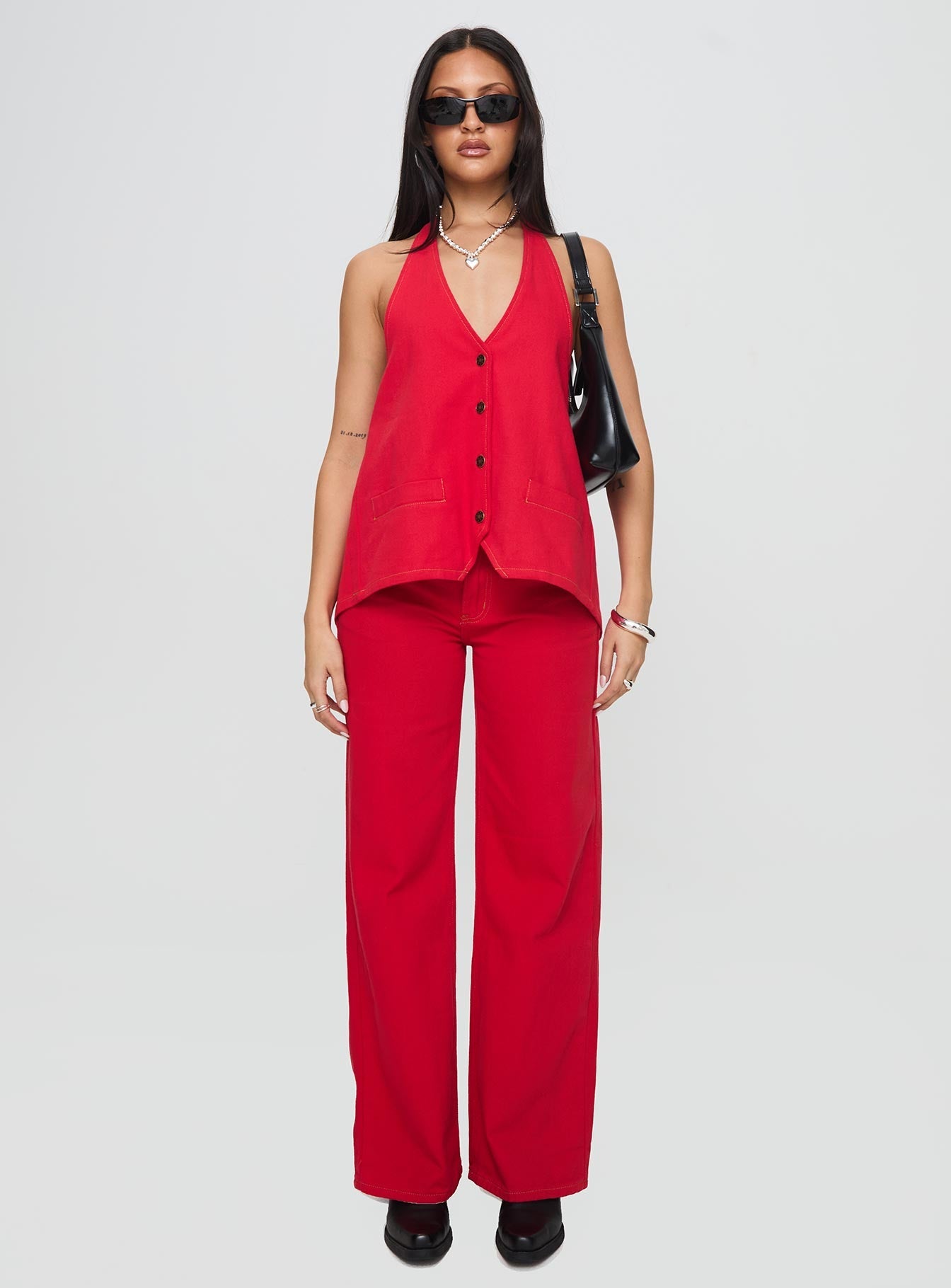 front view of model wearing Princess Polly Hills Halter Crimson Sleeveless V-Neck 