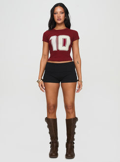 side view of model wearing Princess Polly Baseline Low Rise Rib Shorts Black High Waisted Shorts 