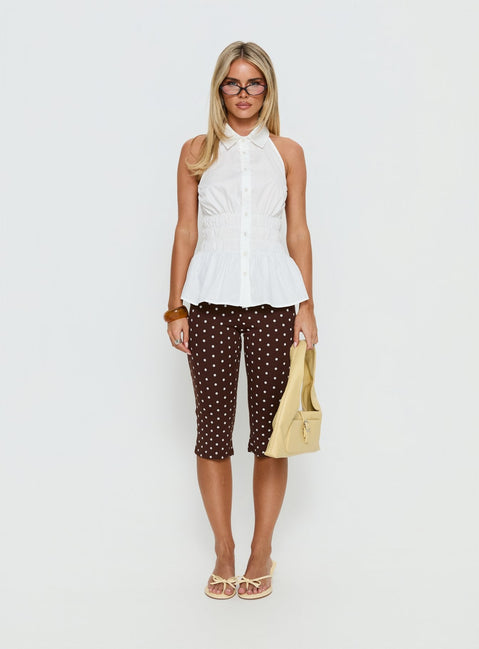 front view of model wearing Princess Polly Samaira Capri Pant Brown Polka Dot Mid Rise Pants 