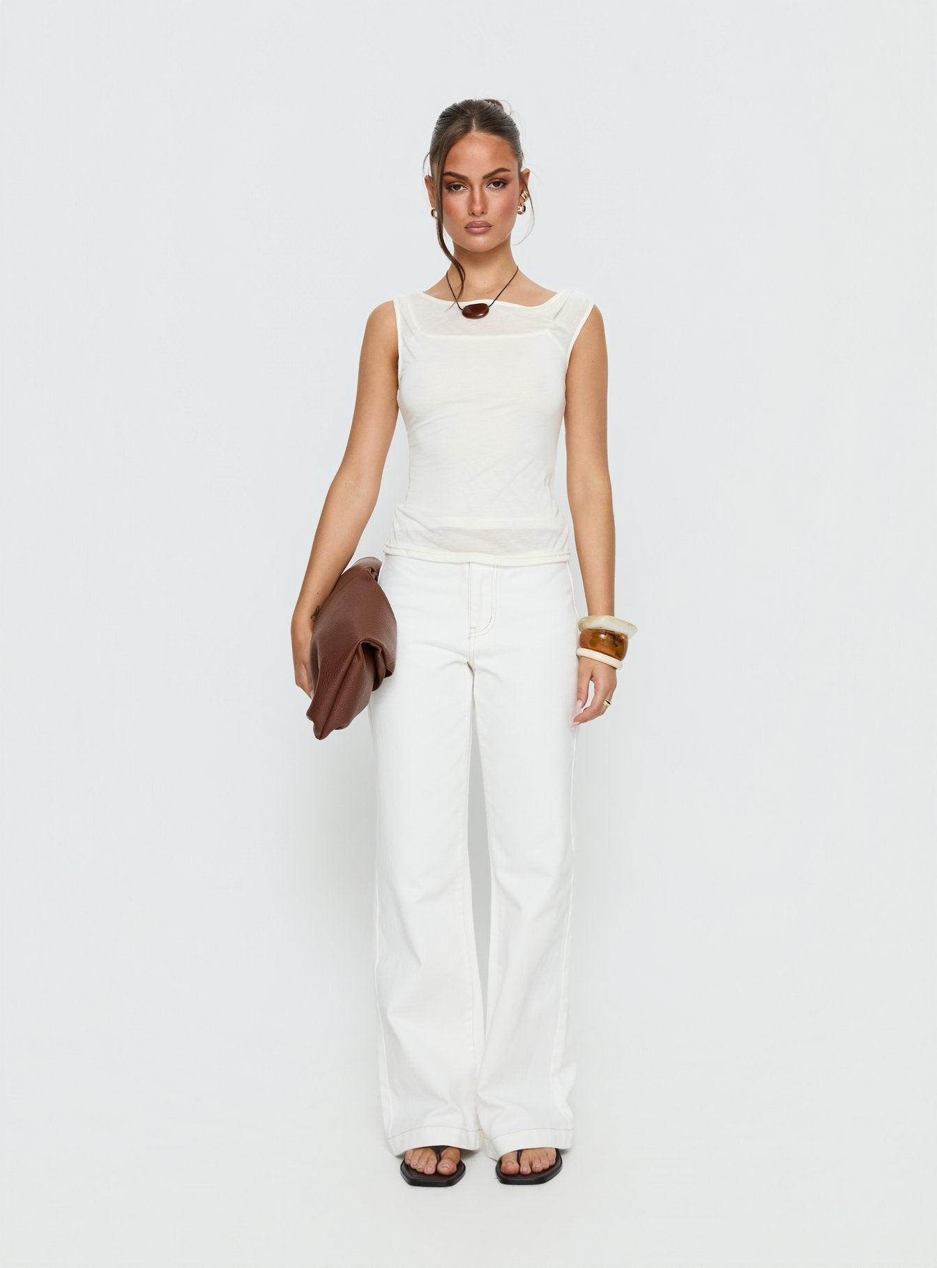 front view of model wearing Princess Polly Buenos No Waist Low Rise Straight Leg Jeans White Mid Rise Jeans 