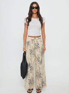 front view of model wearing Princess Polly Naylor Mid Rise Wide Leg Jeans Animal Spot Mid Rise Jeans 