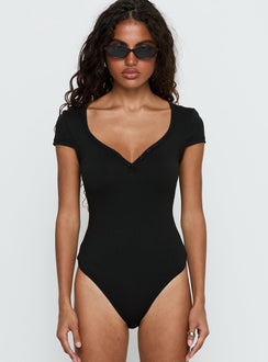 front view of model wearing Princess Polly Laretta Button Up Bodysuit Black Short Sleeve 