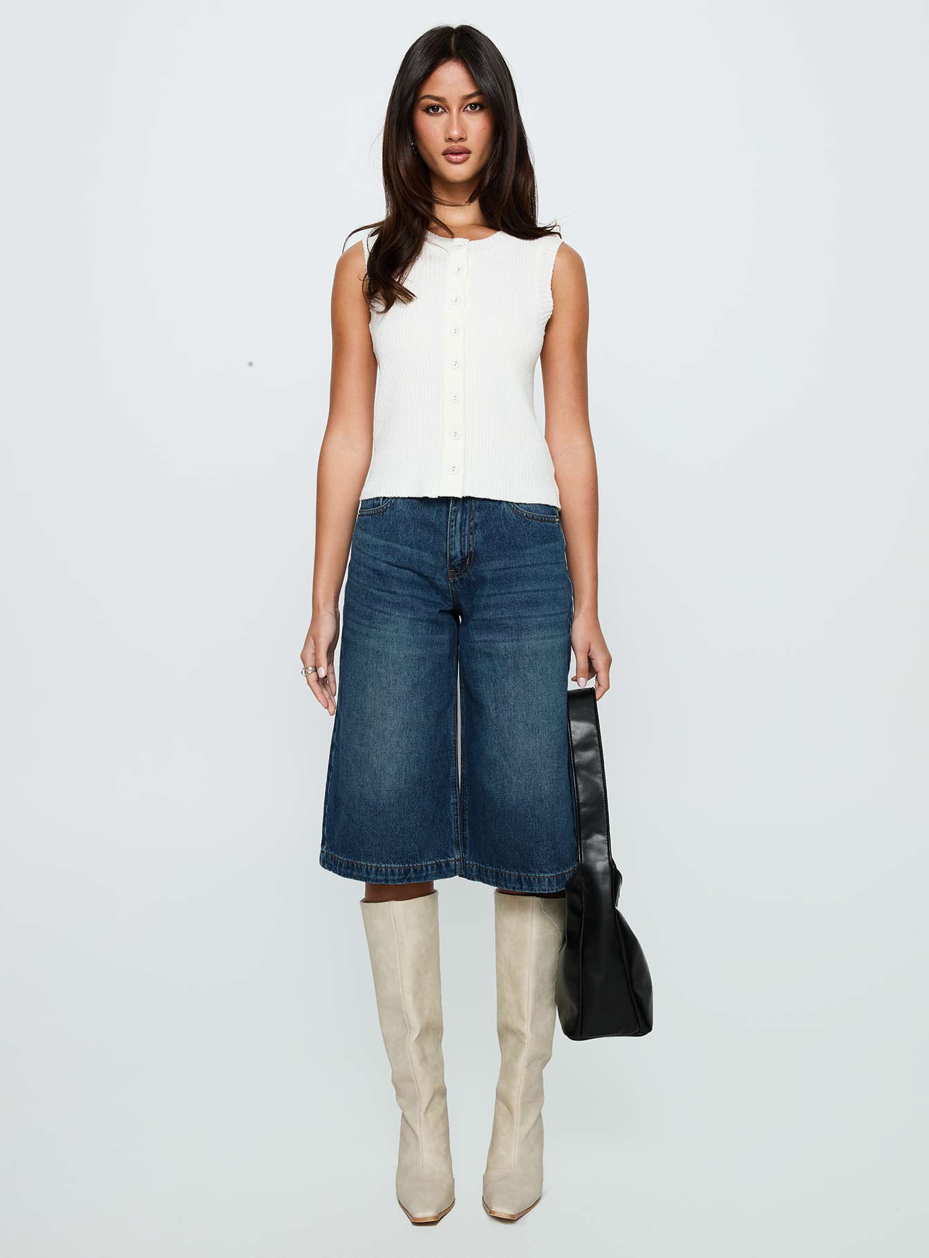 side view of model wearing Princess Polly Ollison Longline Denim Shorts Blue High Waisted Shorts 