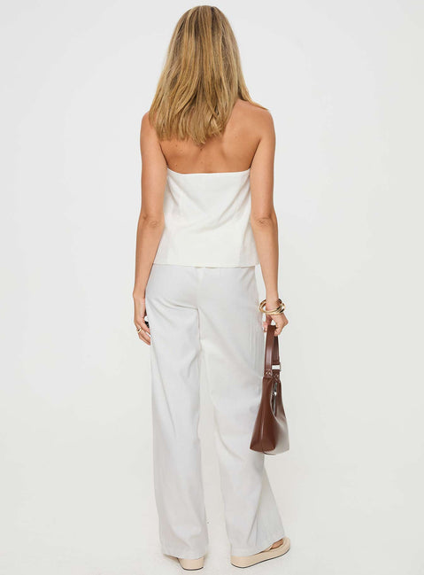 White Matching linen set Halter neck top, fixed halter strap, button fastening at front, twin hip pockets High rise pants, belt looped waist, zip and button fastening, elasticated waistband at back, twin hip pockets, straight leg