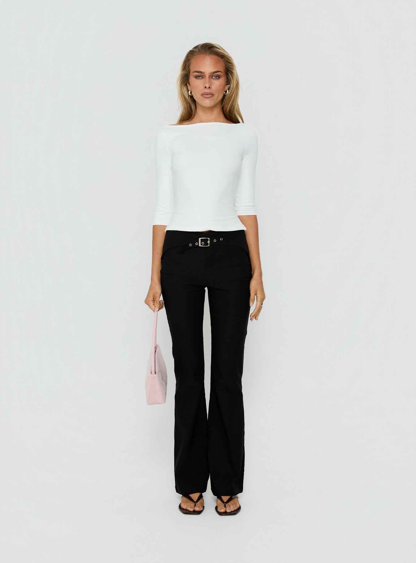 Crafted with the Viridian Belted Flared Pants Black womens-regular-pants in high-rise front view of model wearing Princess Polly