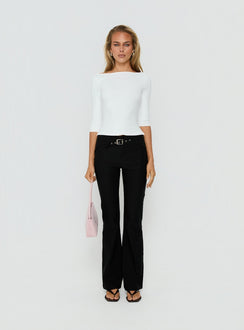 Crafted with the Viridian Belted Flared Pants Black womens-regular-pants in high-rise front view of model wearing Princess Polly