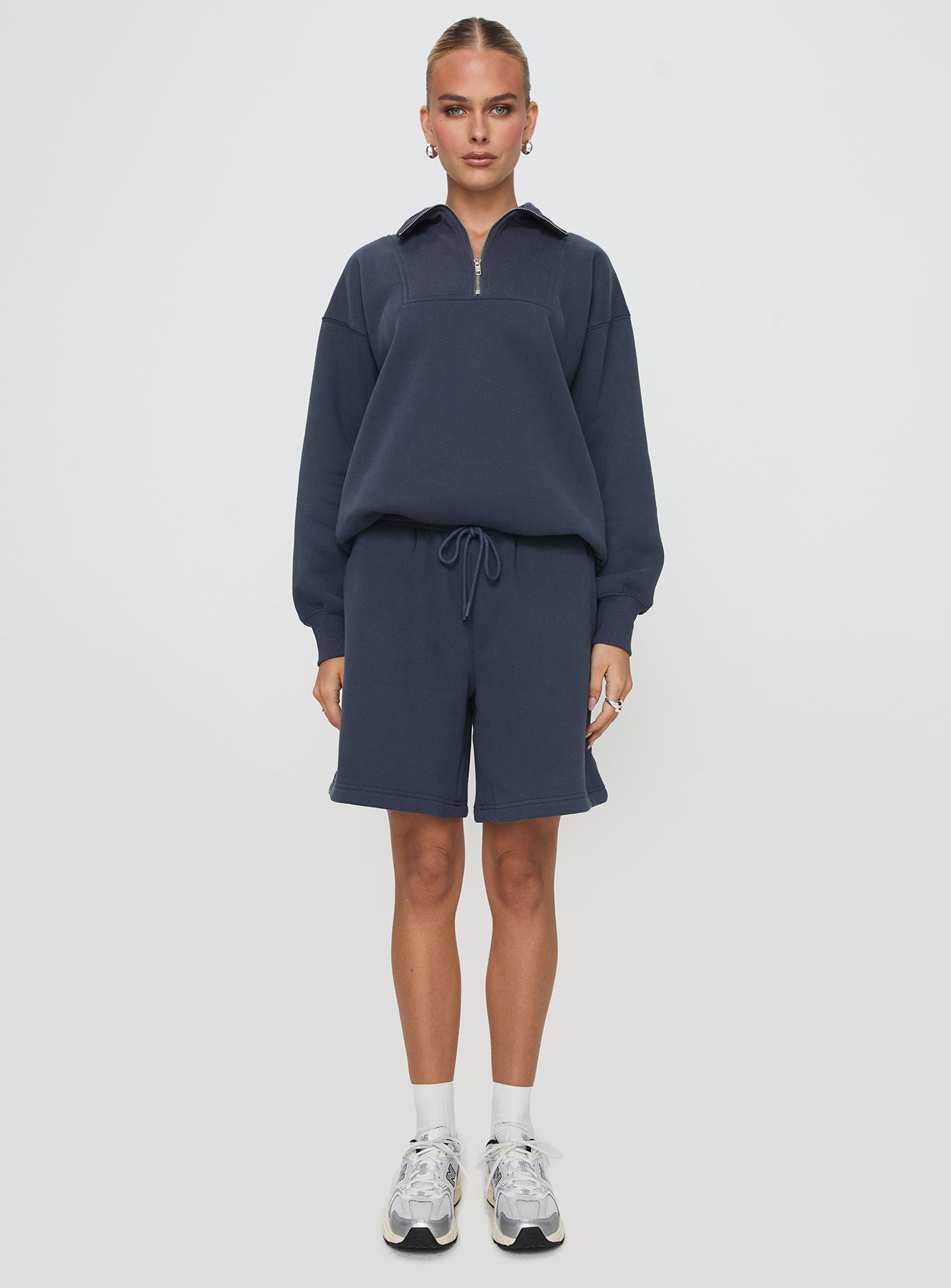 side view of model wearing Princess Polly Dream Fleece Quarter Zip Sweatshirt Navy 