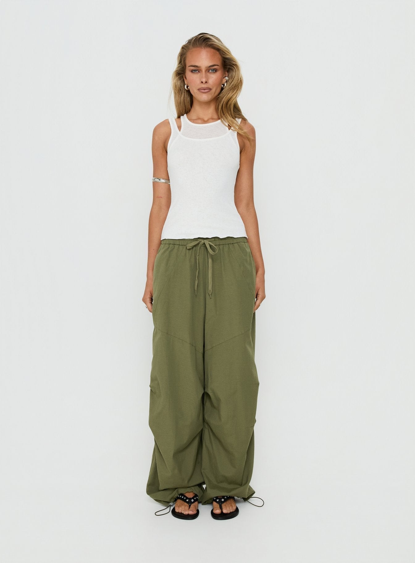 Discover the Mankind Baggy Cargo Pants Olive in womens-regular-pants with mid-rise waist front view of model wearing Princess Polly