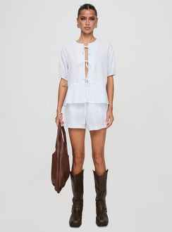 front view of model wearing Princess Polly Sunblind Shorts White High Waisted Shorts 