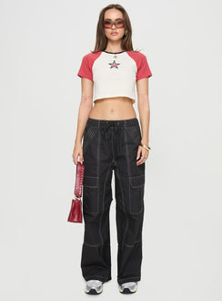 front view of model wearing Princess Polly Soria Cargo Pants Black Low Rise Pants 